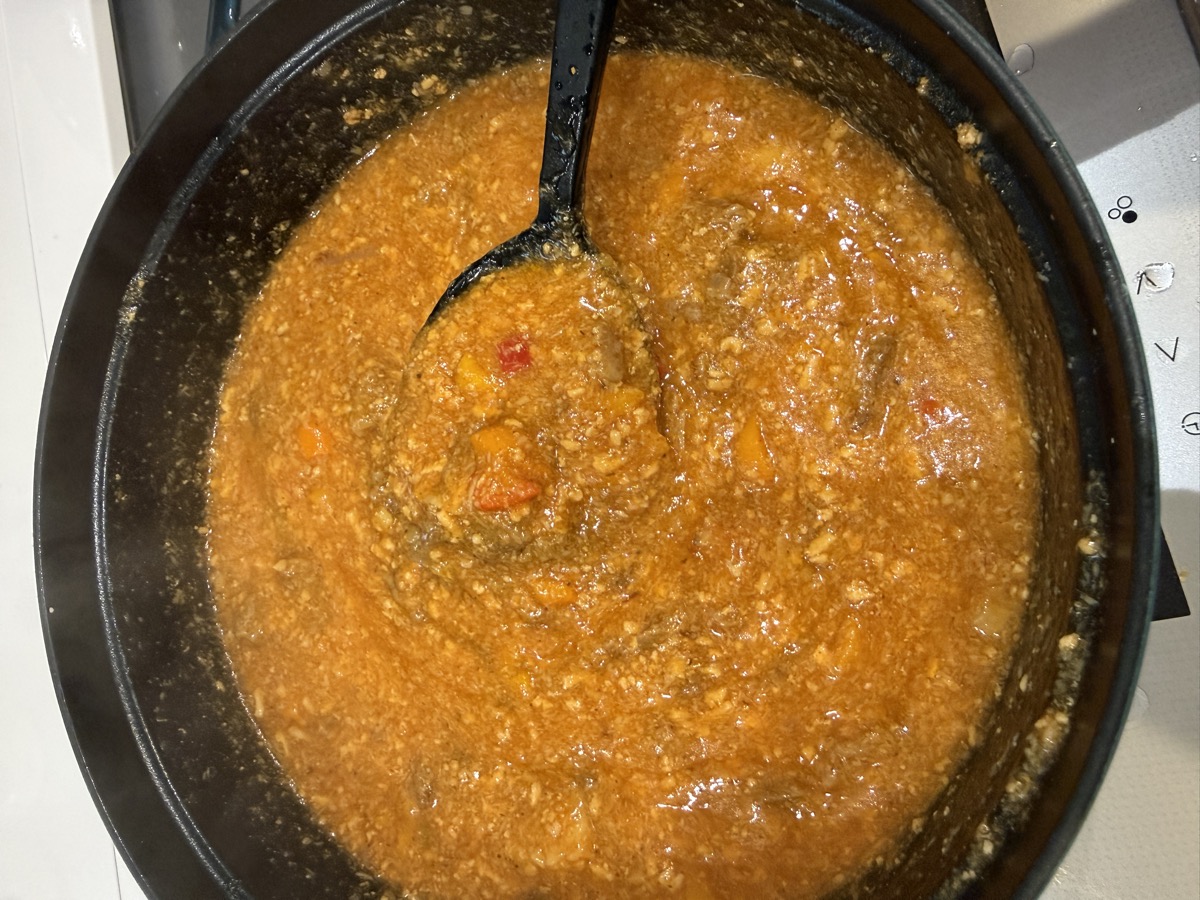 A full Staub pot of golden-glistening Ultimate Beef Tendon Mapo Meat Miso