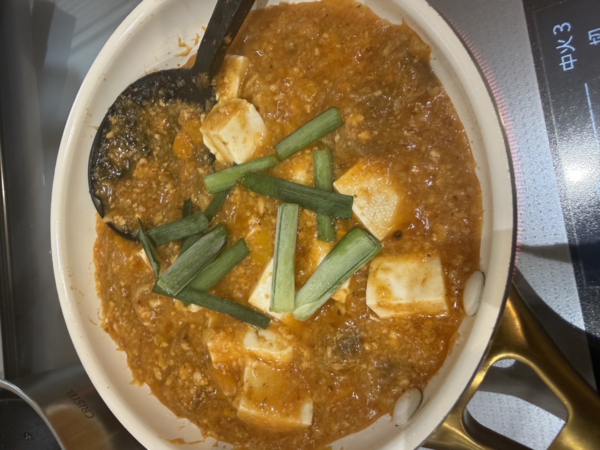 Finished Ultimate Beef Tendon Mapo Tofu simmered in a Staub pot